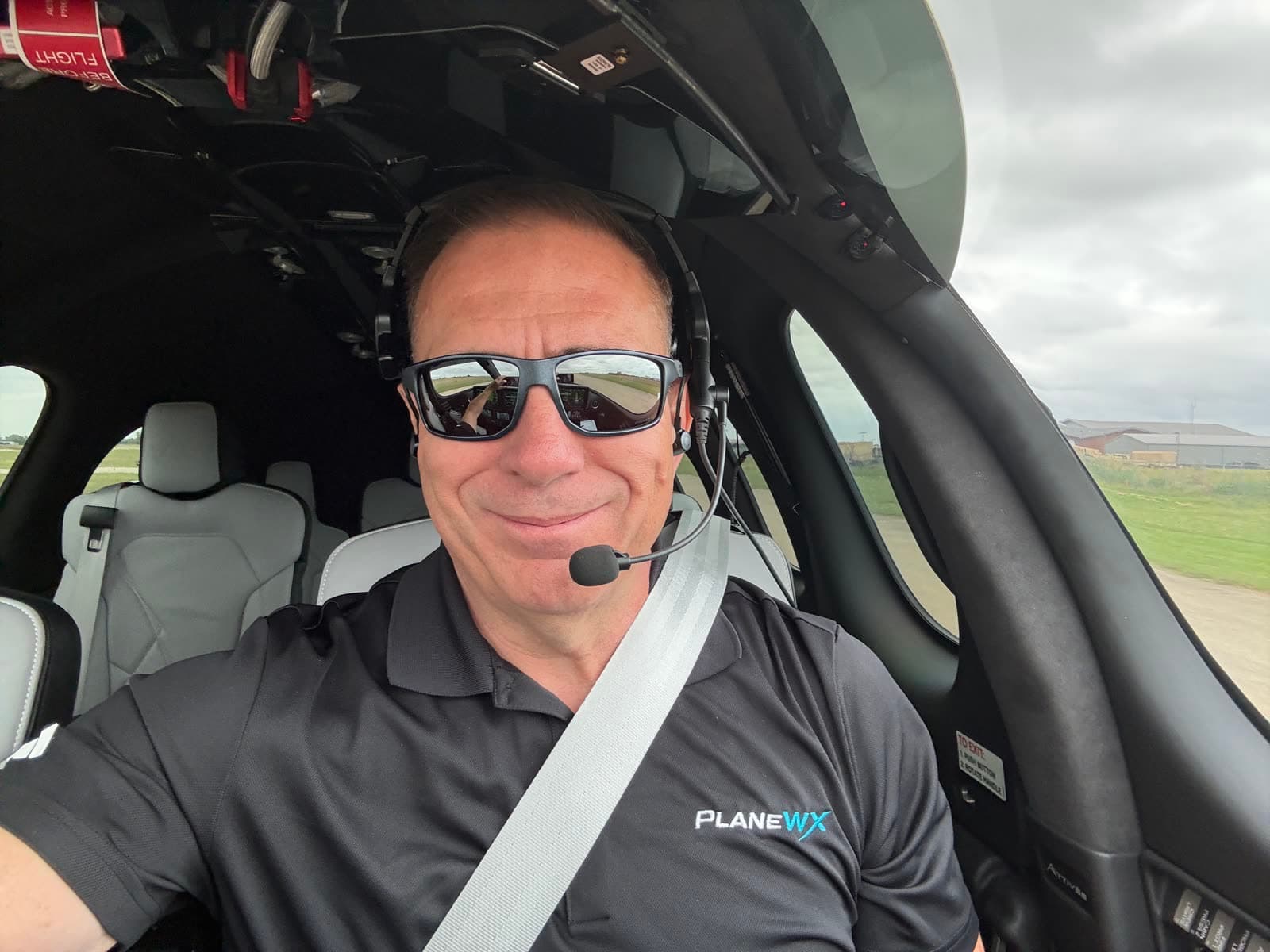 Don Medine wearing a PlaneWX polo on the flight deck