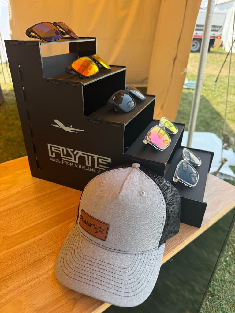 Flyte sunglasses display and PlaneWX hat