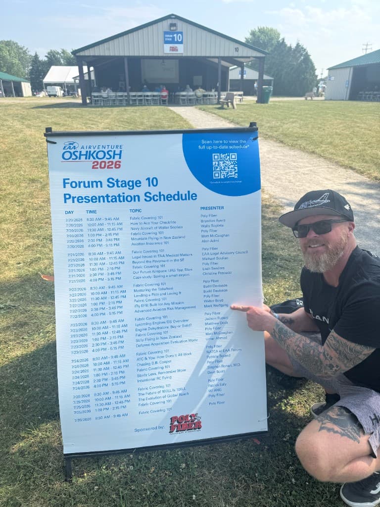 Mark Wolfgang pointing to his Forum Stage 10 talk on the AirVenture schedule